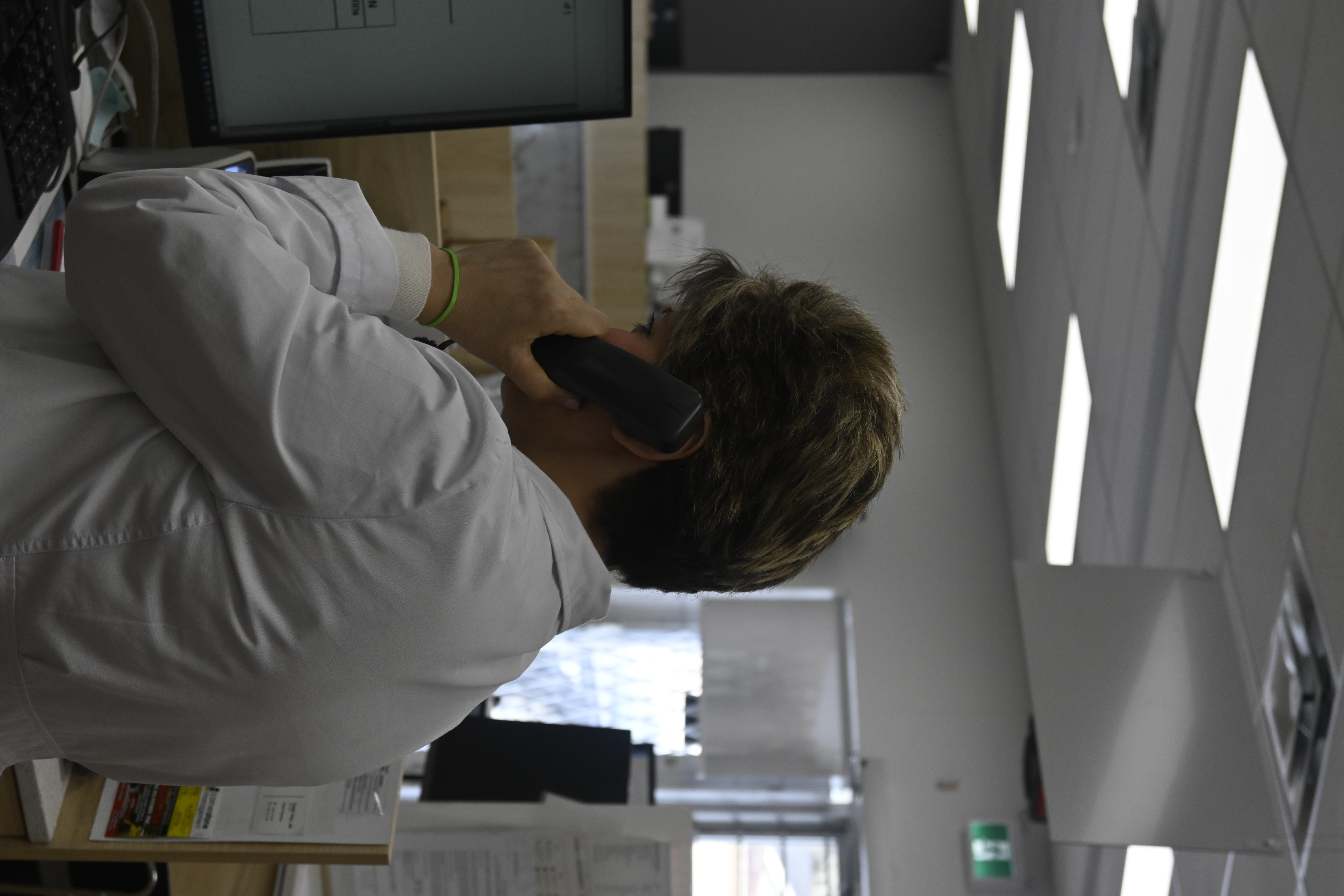 Pharmacist answering patient questions