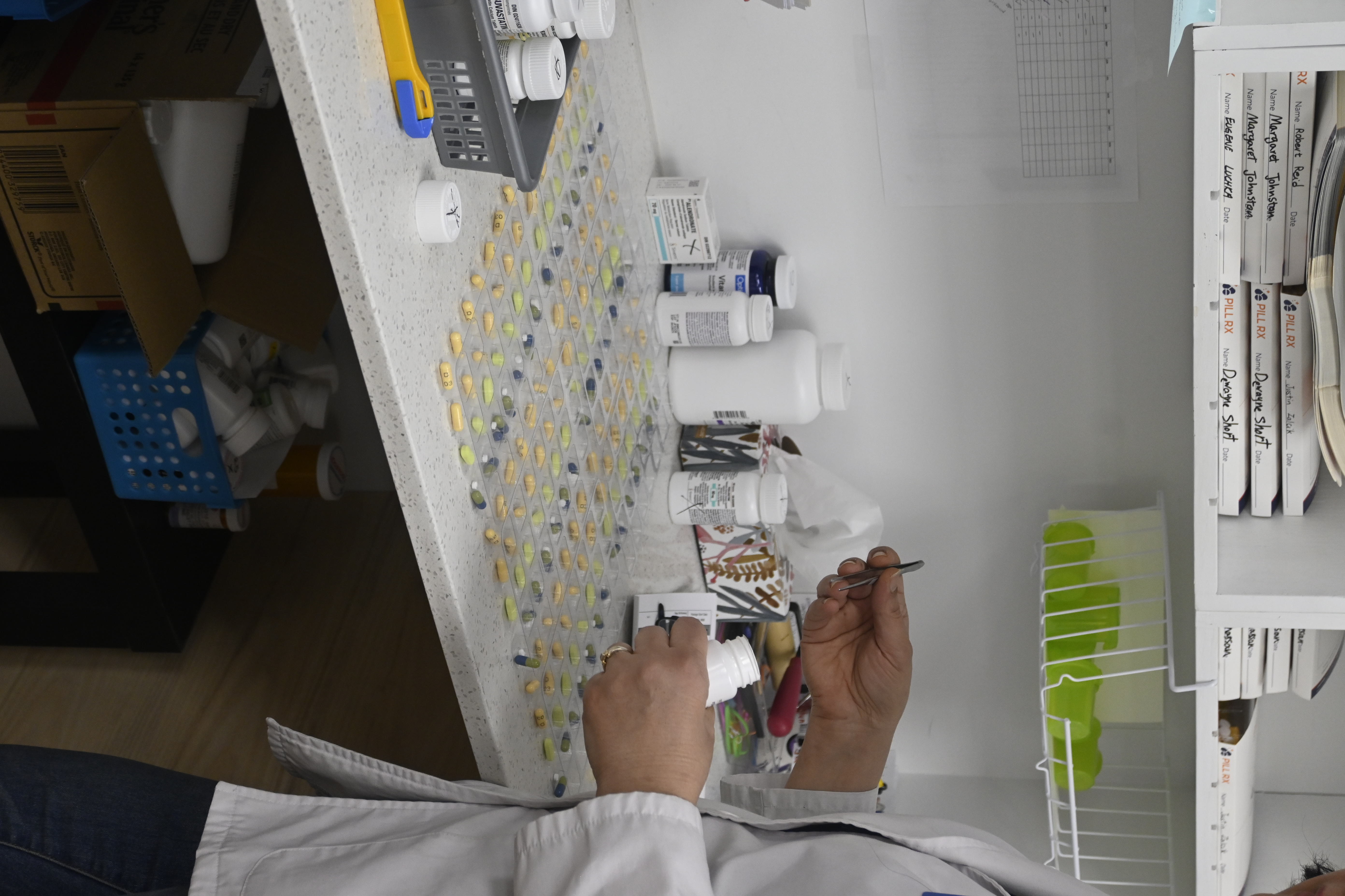 Pharmacist preparing blister packaging