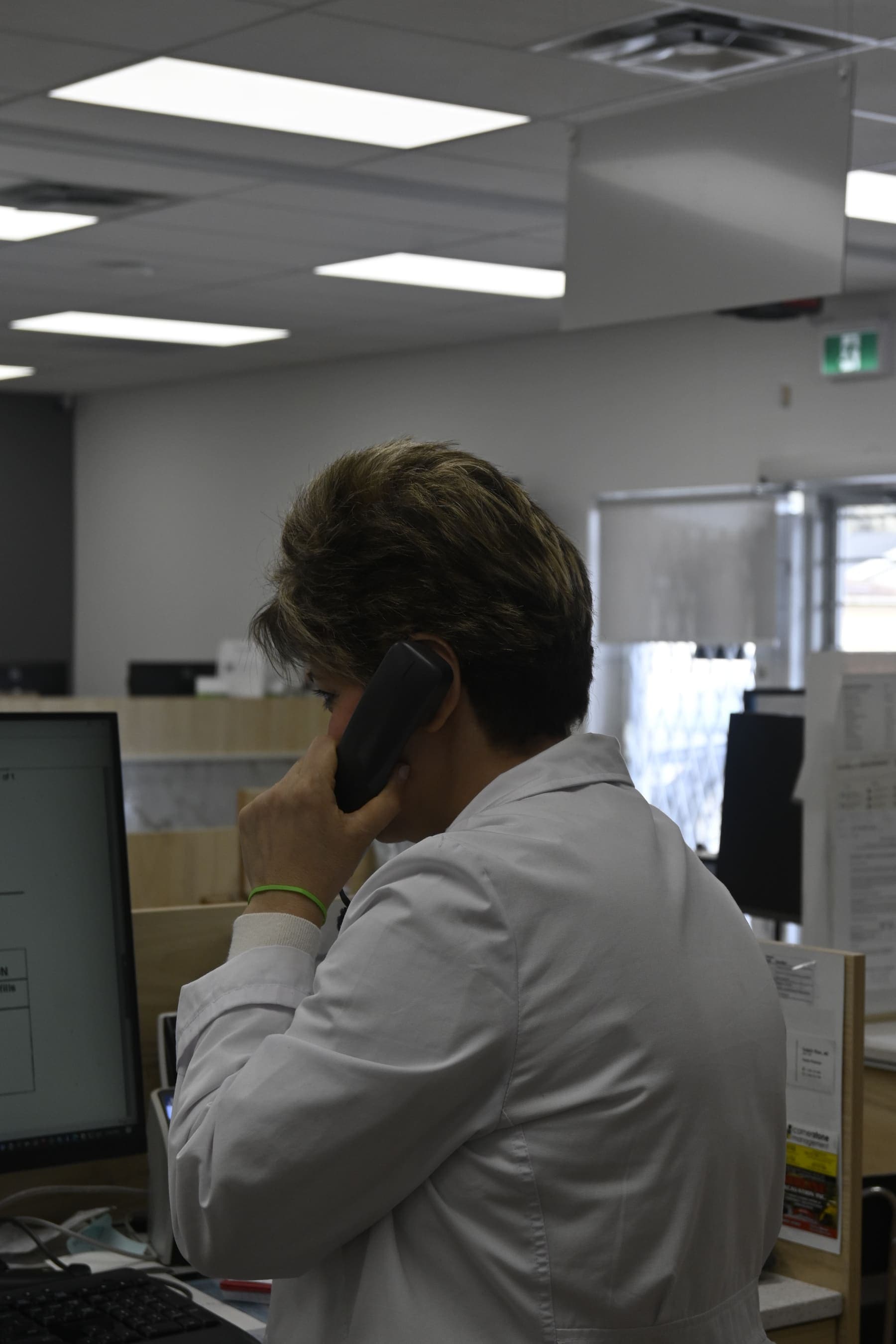 Pharmacist answering patient questions