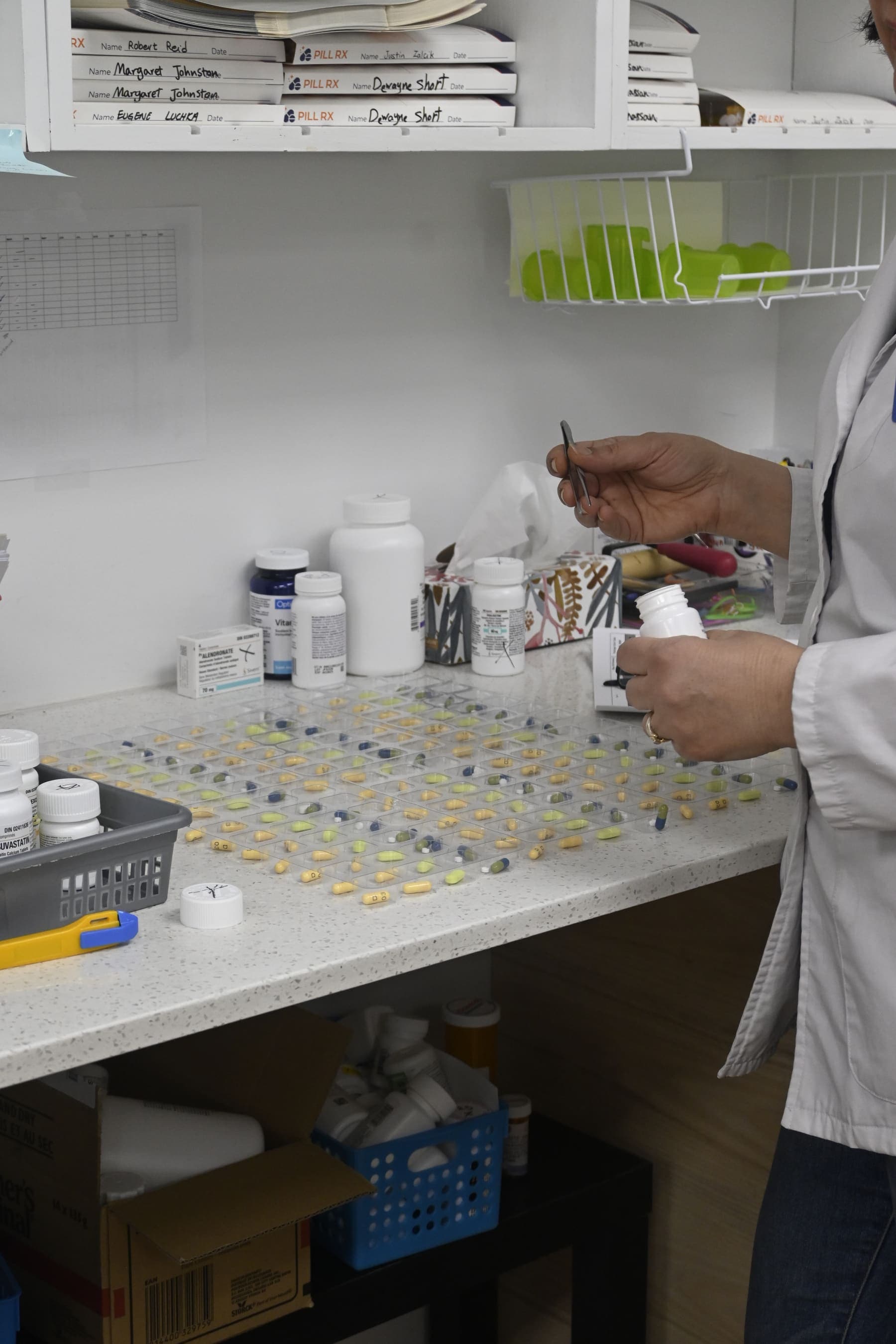 Pharmacist preparing blister packaging